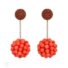 Long cinnamon-colored glass and coral beaded earrings